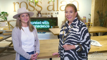 image of woman with tan felt hat and woman with zebra print shirt in wood furniture showroom at High Point Market