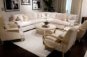 image of living room set with side chairs, cream color furniture and rug