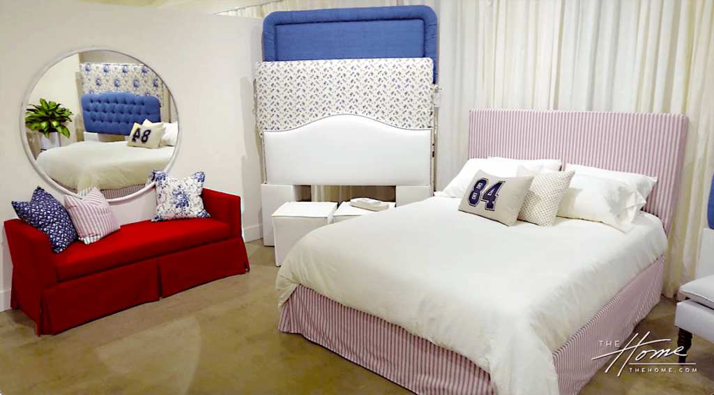 image of room with red sofa and bed with headboards and pillows