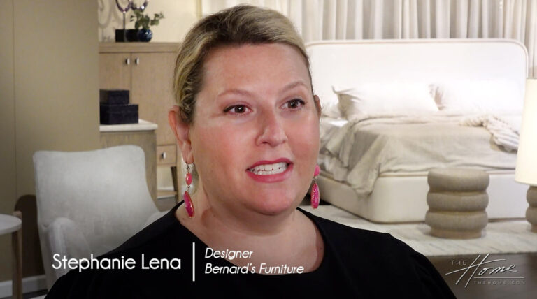 image of woman with black shirt in front of modern upholstered chair, bed, and ottoman. Text: Stephanie Lena Designer, Bernards Furniture