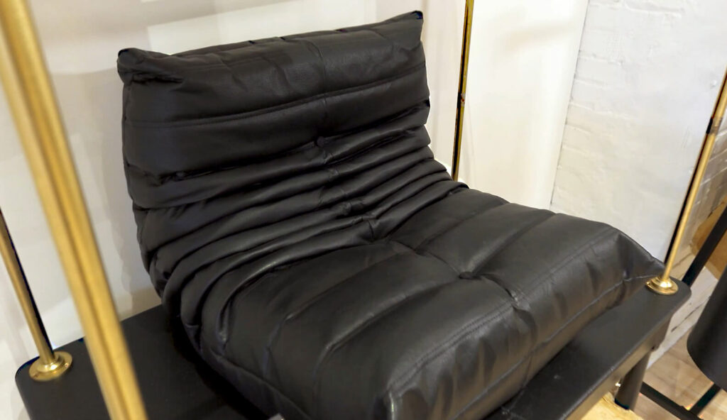 Image: black leather alternative couch by MycoWorks Reishi sustainable materials