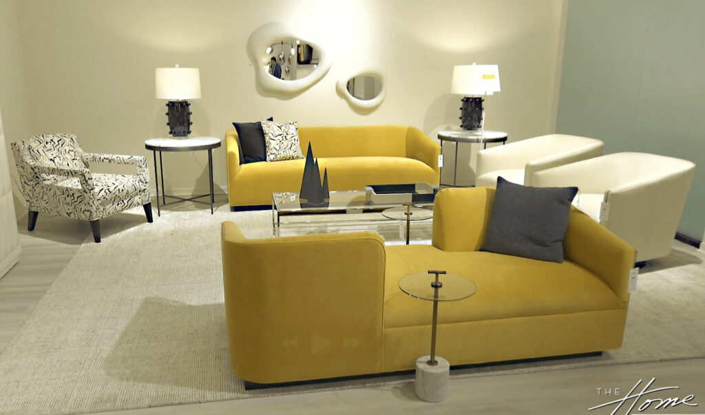 image of living room with 2 yellow modern couches, 2 beige modern swivel chairs, 2 organic shaped mirrors and white topped side tables