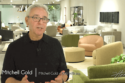 image of man in black shirt with glasses in front of modern iconic chairs and couches