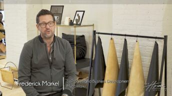 Image: man in gray zip sweater sitting next to rack of black and tan leather alternative samples