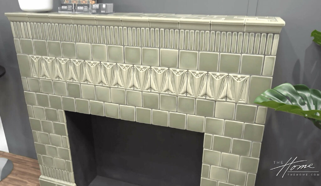 Image: fireplace tiled with Louis Sullivan design ceramic art tiles in muted sage green