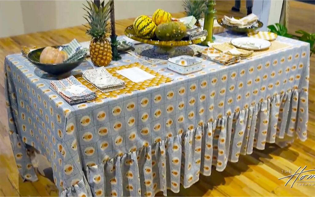 Image: Soil to Studio Indian hand printed tablecloth of blue, white and yellow, linens, table with napkins, fruit bowl