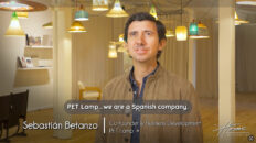 Image of Spanish man in brown leather jacket in room full of glowing pendant lights. Text: PET Lamp...we are a Spanish company. Sebastian Betanzo, Co-founder & Business Development, PET Lamp