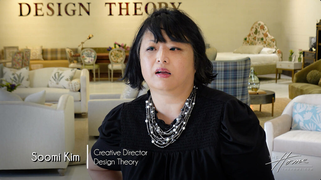 Image: Soomi Kim, asian woman with short hair, black shirt and pearl necklace, in Design Theory Furniture showroom